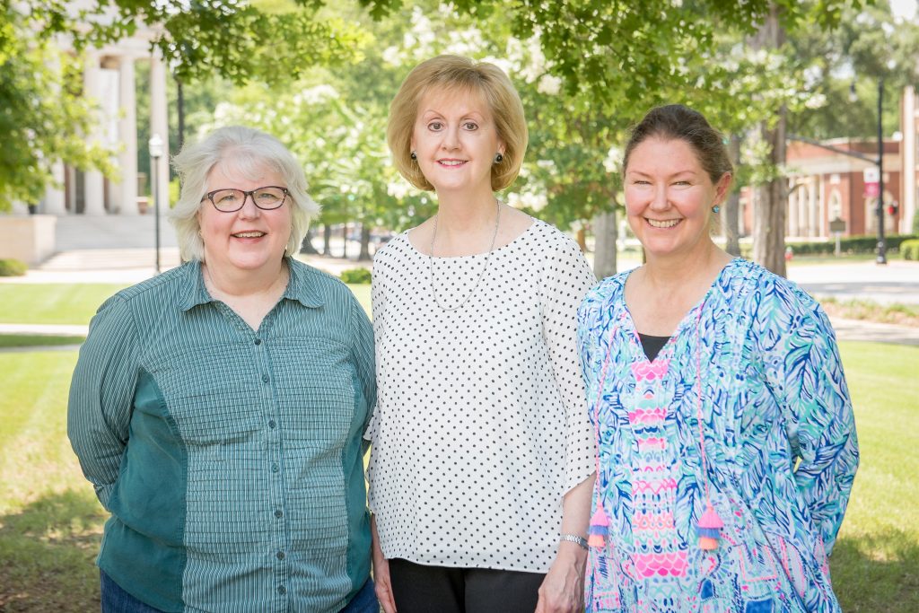 Three Faculty Senate officers standing on the UA Quad